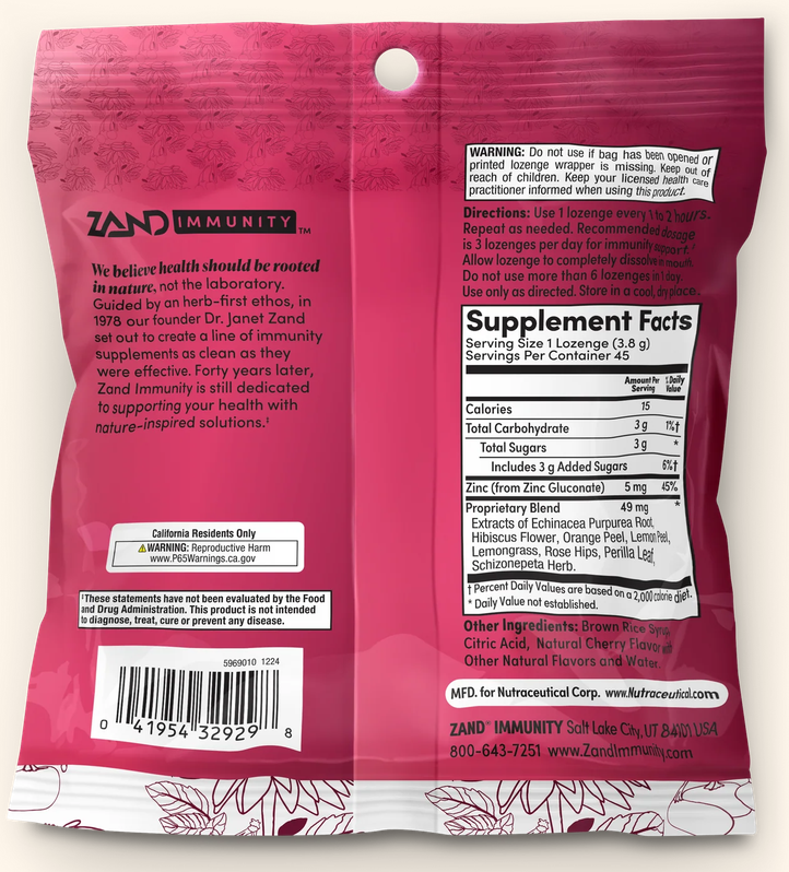The back of a pink Zand Immunity herbal supplement pouch, showing the back of the packaging with product information, a warning label, a barcode, and the Supplement Facts panel.