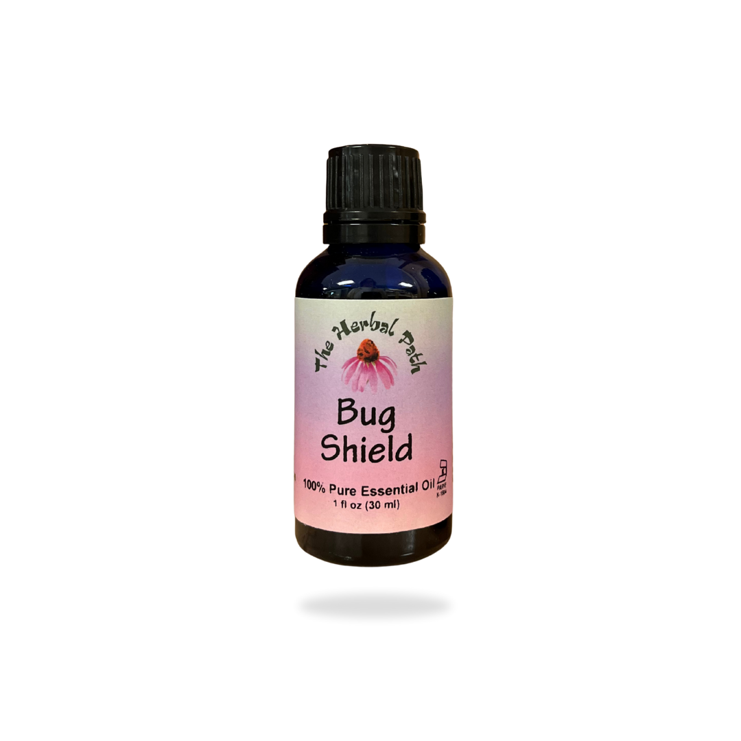 Bottle of 'Bug Shield' essential oil with a pink label on a white background.