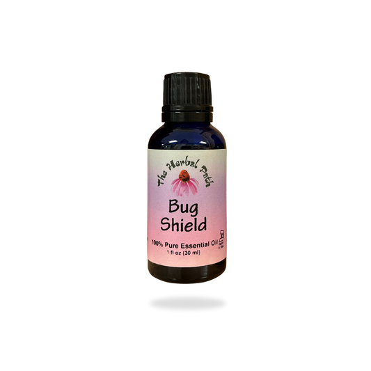 Bottle of 'Bug Shield' essential oil with a pink label on a white background.