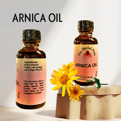 Two bottles of Arnica Oil with a yellow flower on a wooden block against a light background