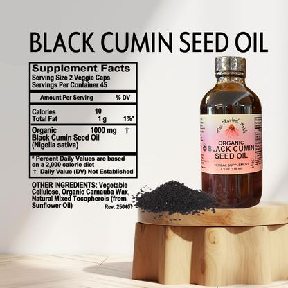 Bottle of organic black cumin seed oil with supplement facts label.