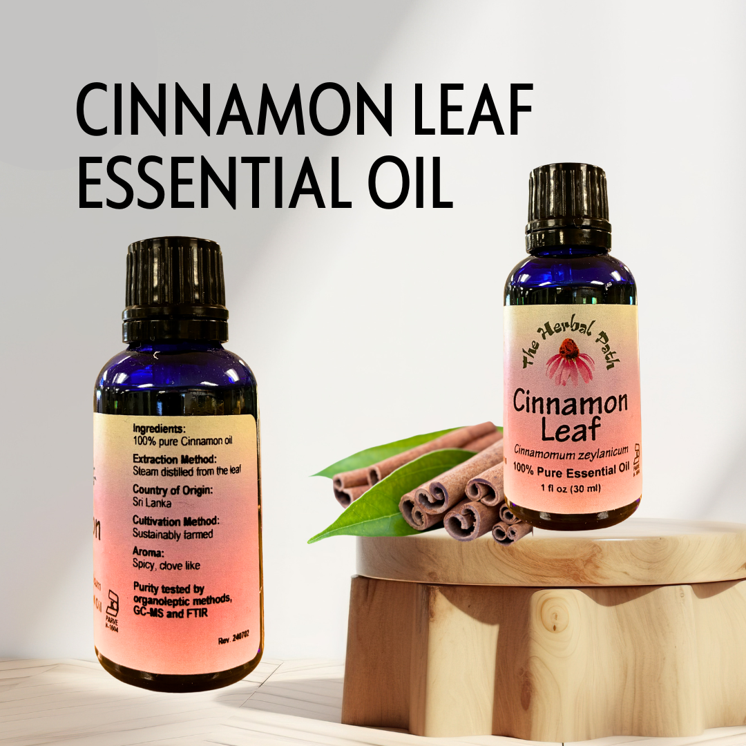 Two bottles of Cinnamon Leaf essential oil with cinnamon sticks and a leaf on a wooden stand.