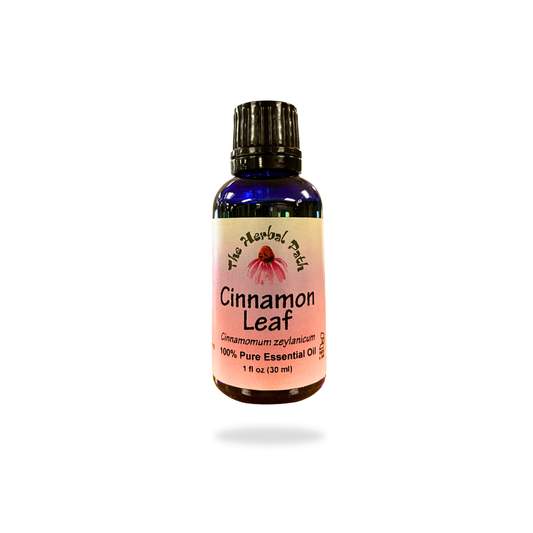 Bottle of cinnamon leaf essential oil on a white background