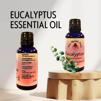 Two bottles of eucalyptus essential oil on a wooden stand with a light background