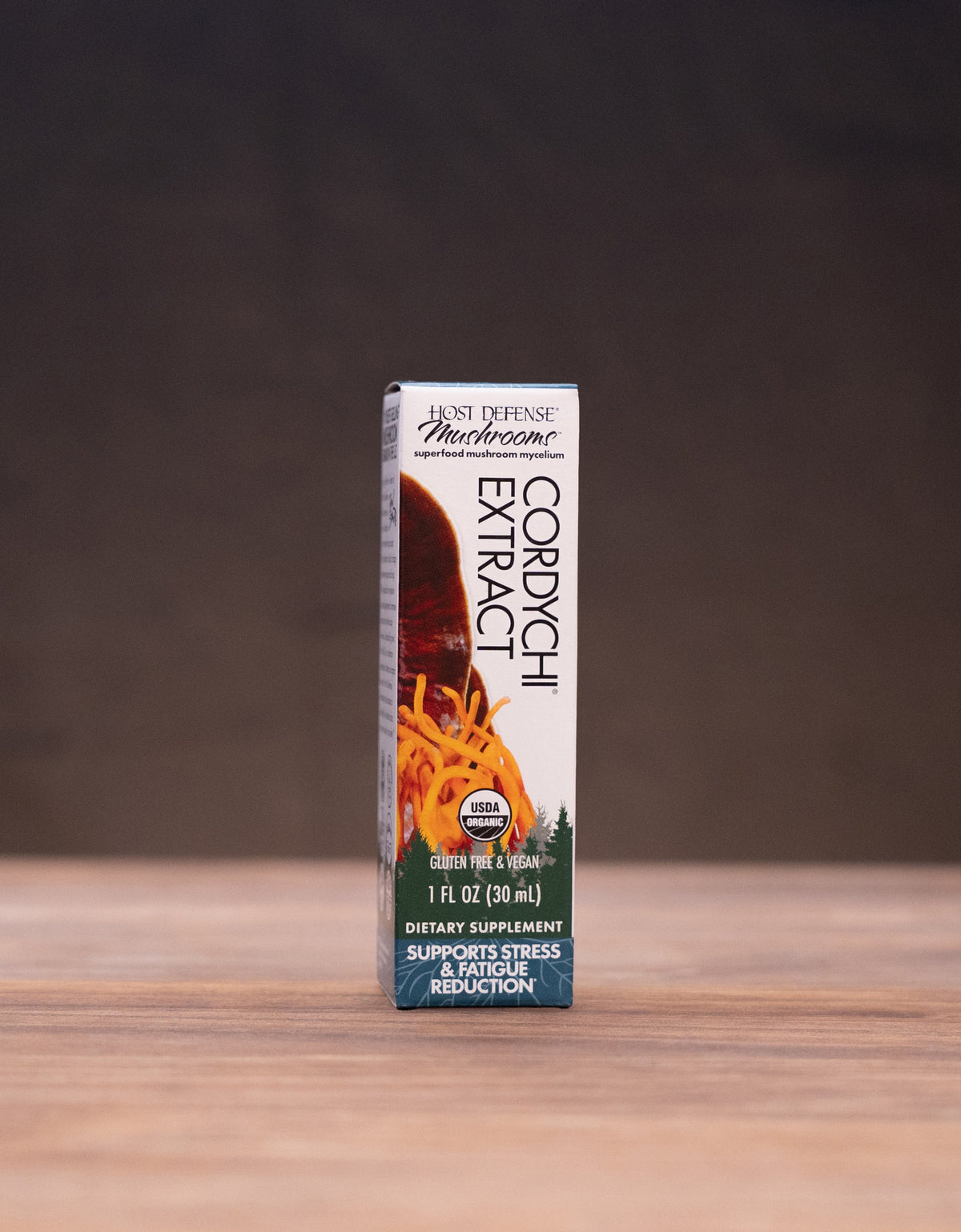 A box of All Purpose All Natural Smokeless Tobacco Salty Smokers in a 1 oz size, standing upright on a wooden tabletop with rustic props in the background.