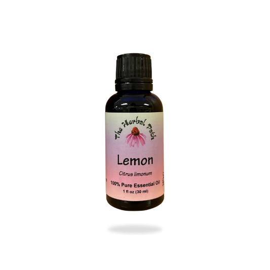 Bottle of lemon essential oil with a white background