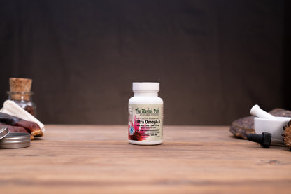 A white bottle of Fluka Herbal Products Ultra Omega 3 dietary supplement, set on a rustic wooden table with blurred natural elements in the background.