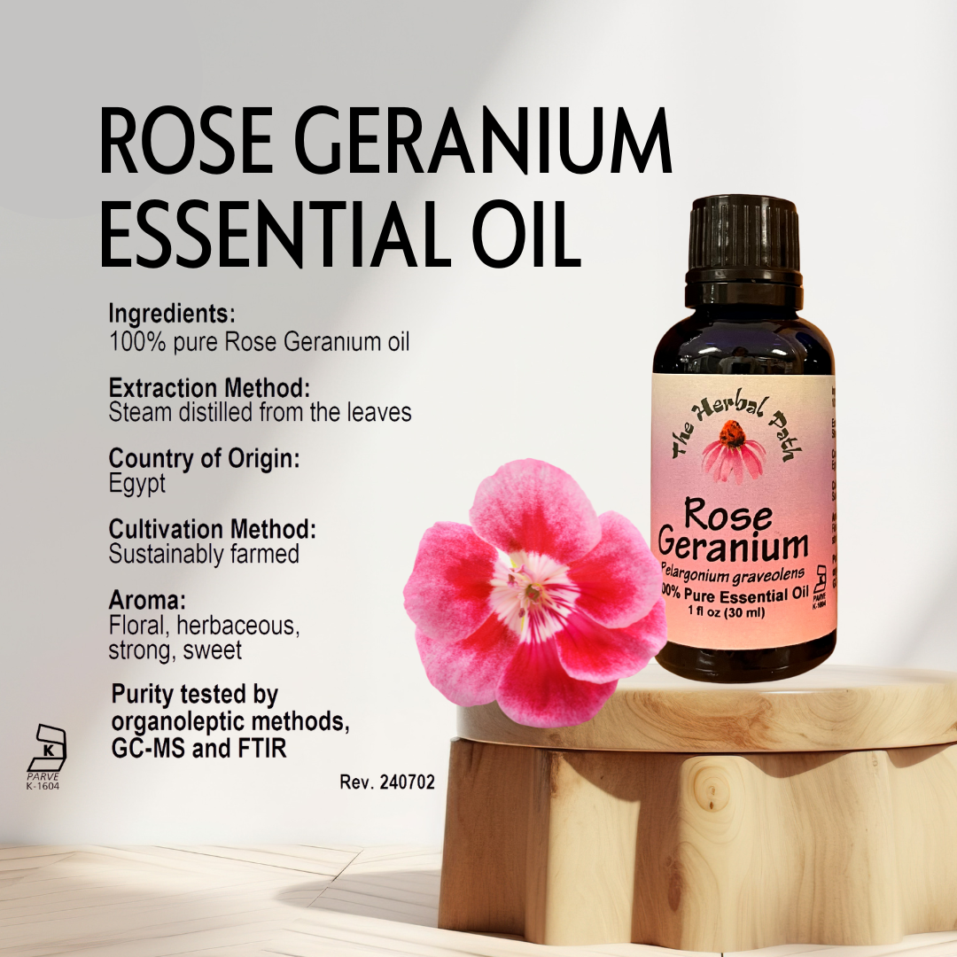 Rose Geranium essential oil bottle with a pink flower on a wooden block against a light background