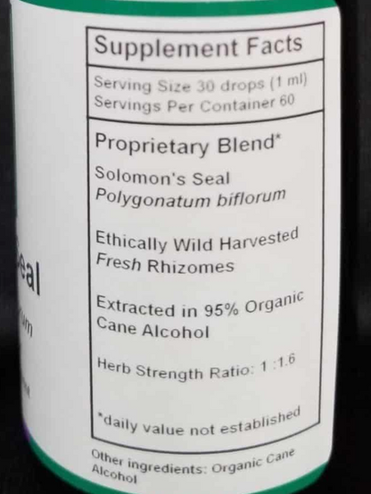 An amber glass dropper bottle with a white label reading 'Supplement Facts' and 'Proprietary Blend' for Solomon's Seal, photographed against a dark textured background.