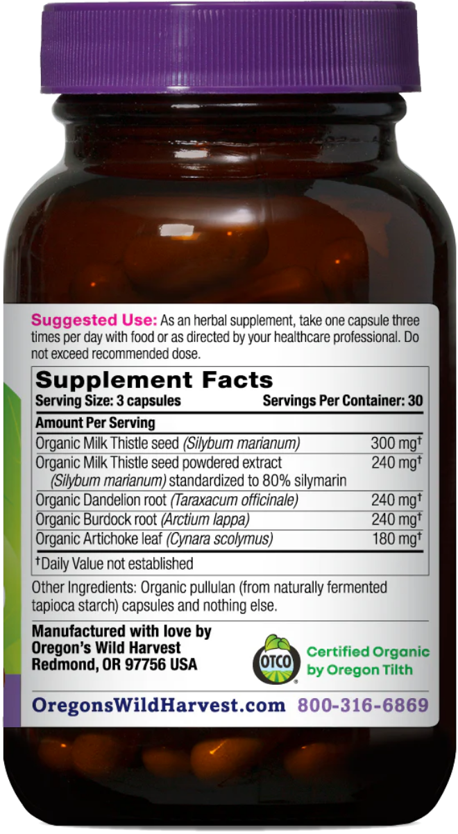 An amber glass supplement bottle with a purple cap, showing a white Supplement Facts label with text about organic milk thistle seed and other ingredients, plus Oregon Wild Harvest branding and a Certified Organic logo.