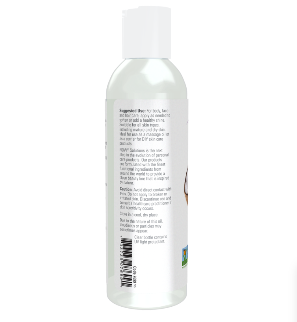 A clear plastic bottle of facial cleanser with a white cap, showing the back label with text and a barcode on a white background.
