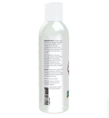 A clear plastic bottle of facial cleanser with a white cap, showing the back label with text and a barcode on a white background.