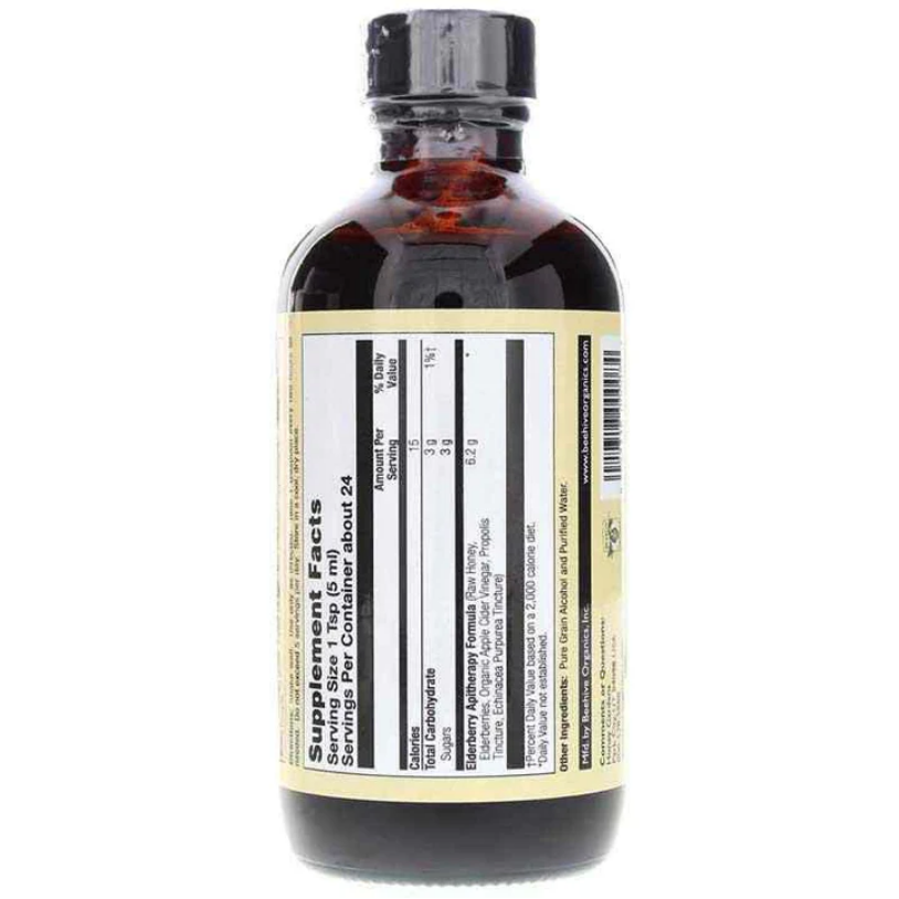 An amber glass bottle with a black cap and a cream-colored label showing the Supplement Facts panel, photographed against a plain white background.
