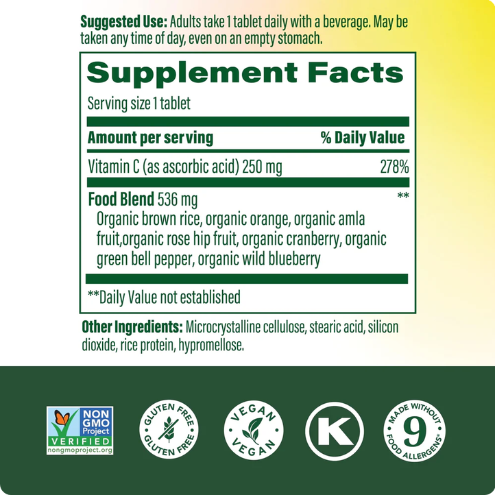 Back label of a dietary supplement showing a Supplement Facts panel with Vitamin C and food blend details, plus certification logos including Non-GMO Project, Gluten Free, Vegan, and K-Verified on a white-to-yellow gradient background with a dark green footer.