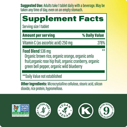 Back label of a dietary supplement showing a Supplement Facts panel with Vitamin C and food blend details, plus certification logos including Non-GMO Project, Gluten Free, Vegan, and K-Verified on a white-to-yellow gradient background with a dark green footer.