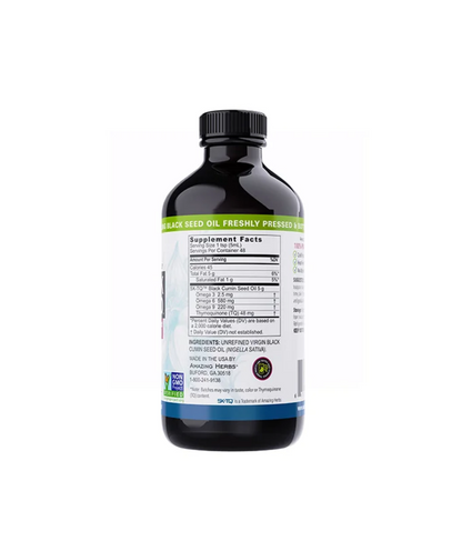 Black bottle with a label on a white background