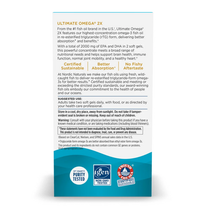 Ultimate Omega 2X supplement packaging shown on a white background, featuring a tall white box with black text and a blue-and-white product box at the bottom. The packaging includes certification badges and usage instructions.