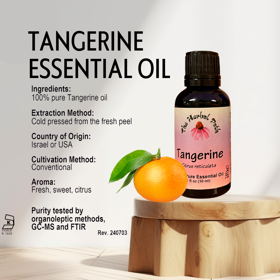 Tangerine essential oil bottle with an orange and leaves on a wooden block against a white background.